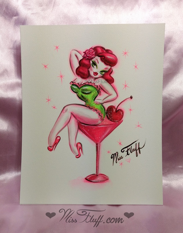 Redhead pinup doll on a pink martini glass
