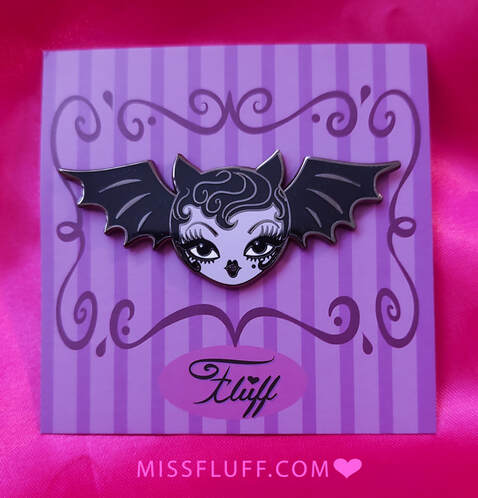 Cute and spooky Halloween enamel pins by Miss Fluff. Featuring a vampire bat dolly!