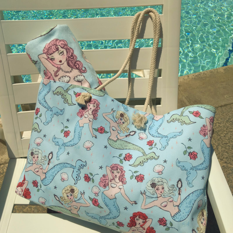 Cute beach tote featuring vintage inspired mermaids in beautiful pastel colors by Miss Fluff.