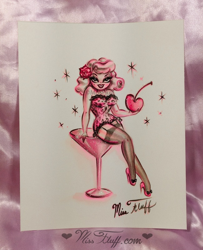 Pin Up girl in pink leopard outfit on a pink martini